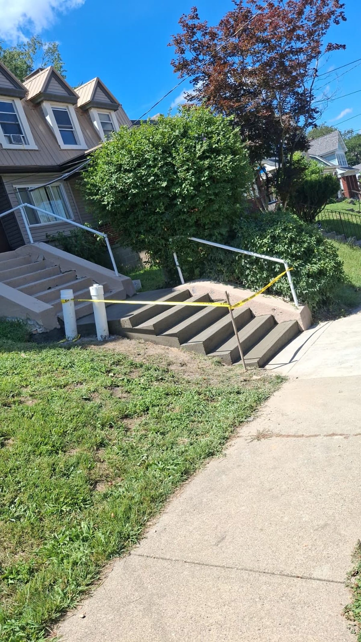 New concrete steps, walkway, and handrails